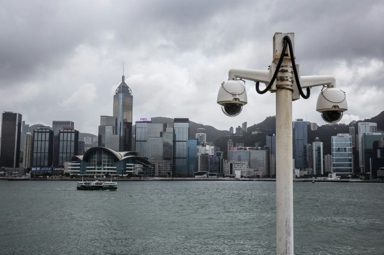 Aktivisten in Hongkong sagen, dass sie verdeckten Treffen, geflüsterten Drohungen und mysteriösen Telefonanrufen ausgesetzt sind, während Peking hart durchgreift.